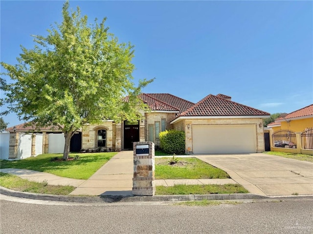 1813 Harvard Ave, Mcallen, TX 78504 - mediterranean / spanish-style house with a tile roof, a garage, fence, and driveway