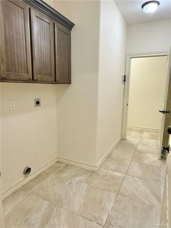 1813 Harvard Ave, Mcallen, TX 78504 - washroom with electric dryer hookup, baseboards, and cabinet space