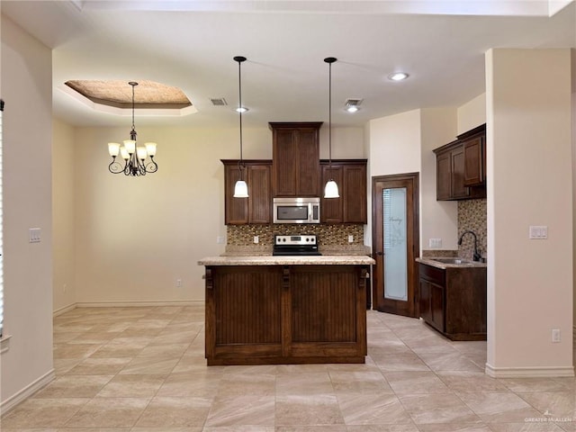 1813 Harvard Ave, Mcallen, TX 78504 - kitchen featuring stainless steel appliances, a sink, decorative backsplash, dark brown cabinetry, and baseboards