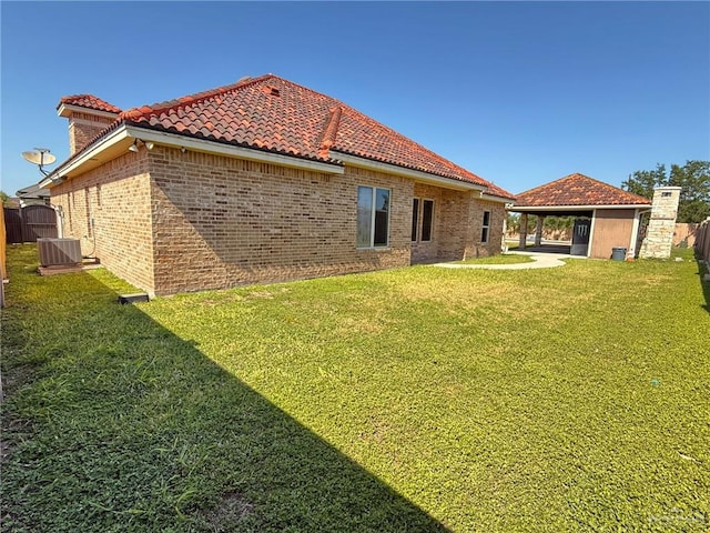 1813 Harvard Ave, Mcallen, TX 78504 - rear view of house featuring cooling unit and a tiled roof