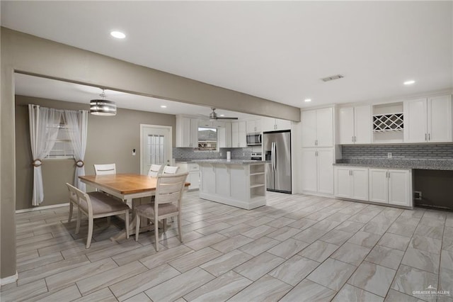 dining area featuring visible vents and recessed lighting