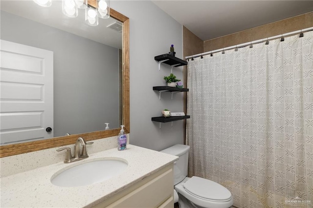 bathroom with vanity and toilet