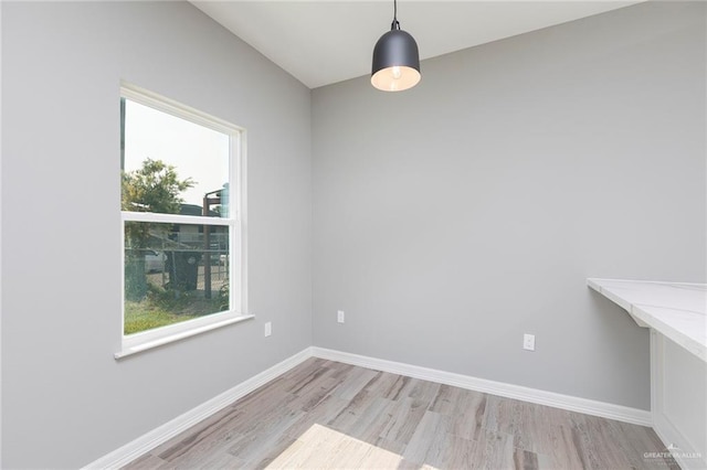 814 N Martinez Ave, Weslaco, TX 78596 - empty room featuring light wood-style floors and baseboards