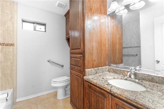 bathroom with tile patterned floors, vanity, and toilet