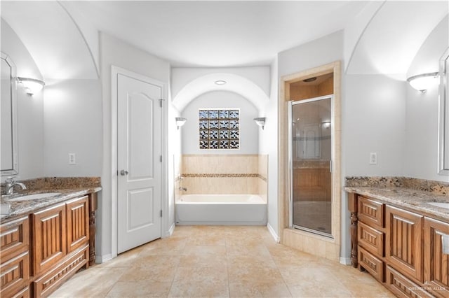 bathroom with separate shower and tub, tile patterned flooring, and vanity