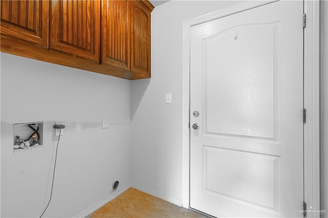 washroom with cabinets and hookup for a washing machine