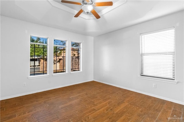 unfurnished room featuring ceiling fan and hardwood / wood-style flooring