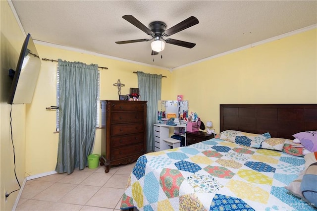 tiled bedroom with a textured ceiling, ceiling fan, and crown molding