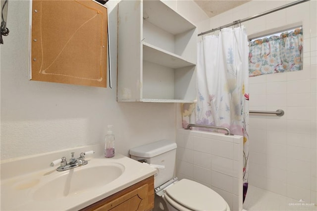 bathroom featuring vanity, toilet, and curtained shower