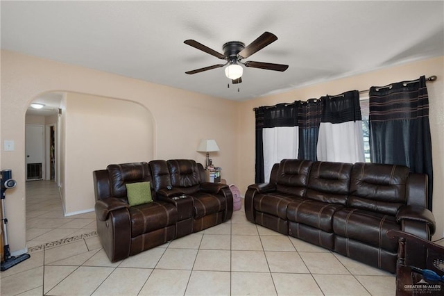 tiled living room with ceiling fan