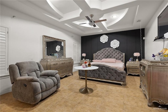 bedroom featuring a raised ceiling, ceiling fan, and coffered ceiling