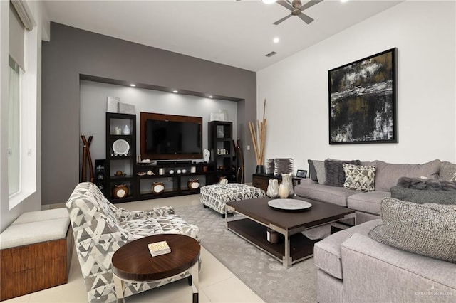 living room with tile patterned floors and ceiling fan