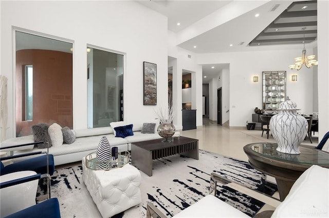 living room with a chandelier and a high ceiling