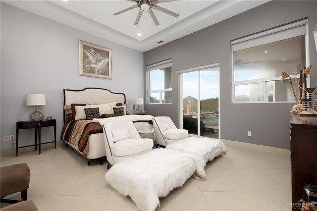 tiled bedroom with access to exterior and ceiling fan