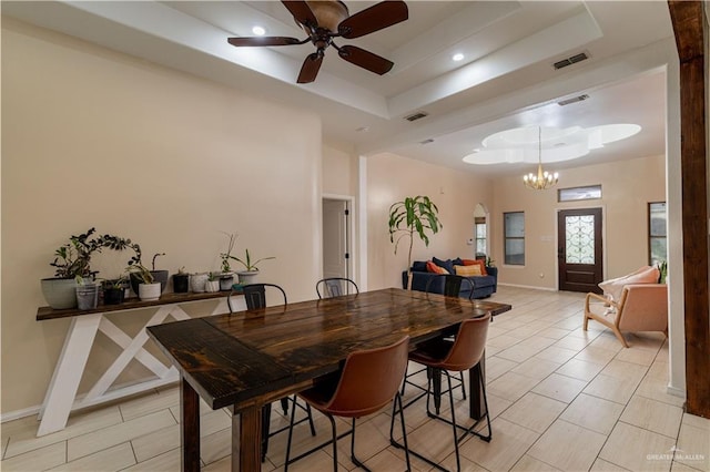 3811 Burr Dr, Edinburg, TX 78542 - dining space with a raised ceiling, a ceiling fan, a chandelier, recessed lighting, and baseboards