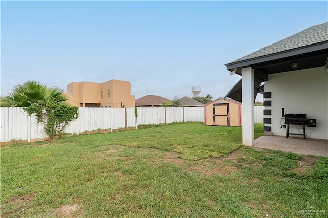 3811 Burr Dr, Edinburg, TX 78542 - view of yard with a storage unit, an outdoor structure, and a patio