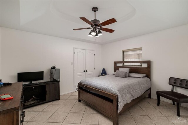 3811 Burr Dr, Edinburg, TX 78542 - bedroom with light tile patterned floors, a closet, a ceiling fan, and baseboards