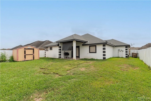 3811 Burr Dr, Edinburg, TX 78542 - back of property featuring a storage unit, an outbuilding, a patio area, and stucco siding
