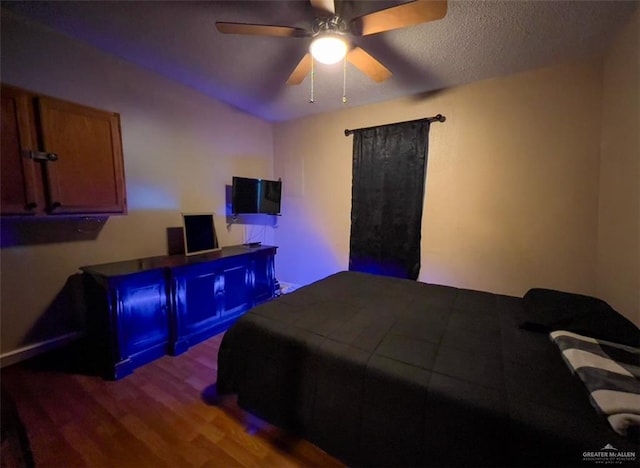 bedroom featuring hardwood / wood-style floors and ceiling fan