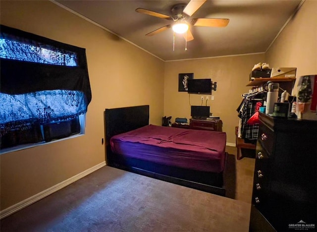 carpeted bedroom featuring crown molding and ceiling fan