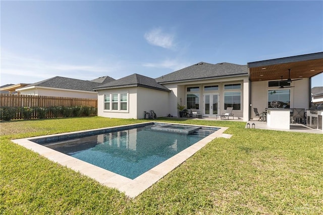 1806 E 28th St, Mission, TX 78574 - rear view of property with a patio, french doors, stucco siding, and an in-ground hot tub