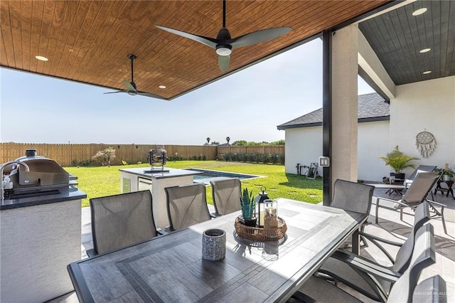 1806 E 28th St, Mission, TX 78574 - view of patio / terrace featuring outdoor dining area, ceiling fan, and a swimming pool