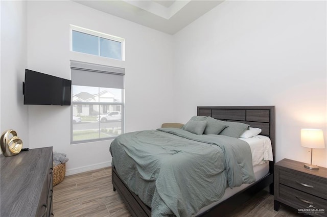 1806 E 28th St, Mission, TX 78574 - bedroom with multiple windows, wood finished floors, and baseboards