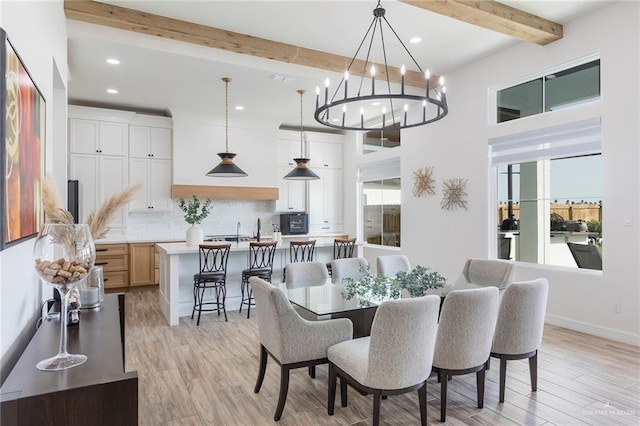 1806 E 28th St, Mission, TX 78574 - dining room featuring beamed ceiling, recessed lighting, light wood finished floors, plenty of natural light, and a chandelier