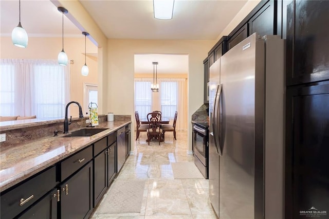 kitchen featuring marble finish floor, decorative light fixtures, a sink, light stone countertops, and stainless steel range with electric stovetop