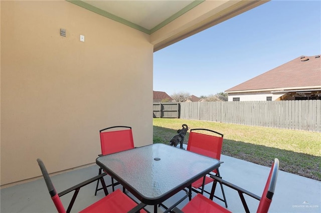 view of patio / terrace with outdoor dining space and fence