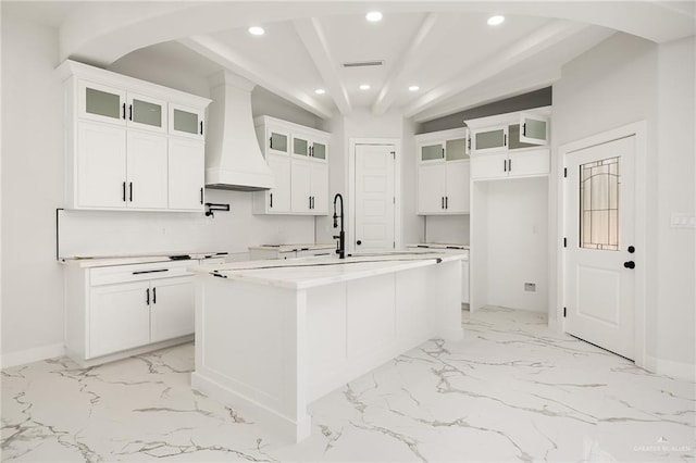 kitchen with premium range hood, marble finish floor, white cabinets, and recessed lighting