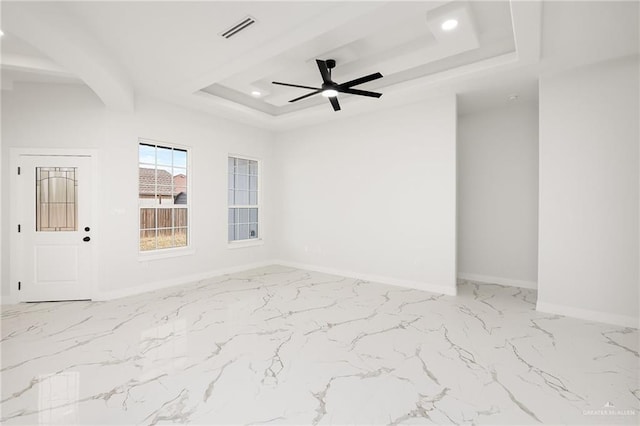 spare room featuring baseboards, visible vents, a tray ceiling, recessed lighting, and ceiling fan