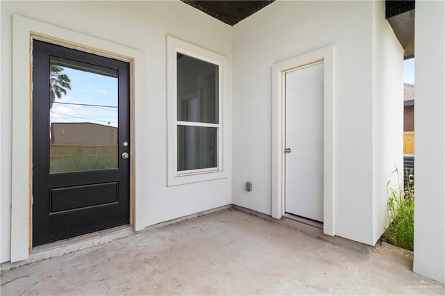803 Ava Dr, La Feria, TX 78559 - entrance to property featuring a patio and stucco siding