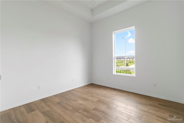 803 Ava Dr, La Feria, TX 78559 - spare room featuring light wood-type flooring, healthy amount of natural light, and baseboards