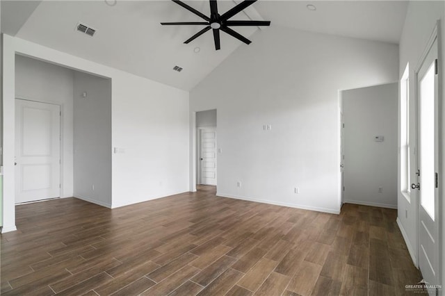 803 Ava Dr, La Feria, TX 78559 - empty room featuring a ceiling fan, high vaulted ceiling, dark wood-style flooring, and baseboards