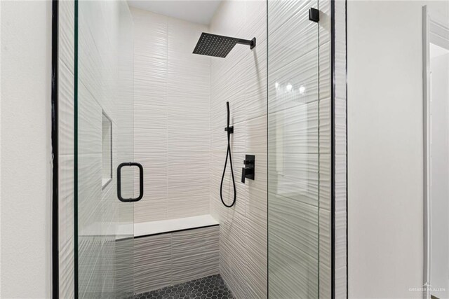 412 Leon Ave, Elsa, TX 78542 - bathroom featuring a shower with shower door