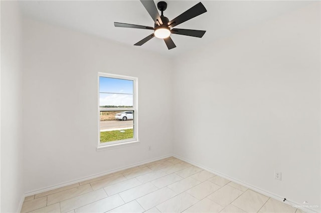 412 Leon Ave, Elsa, TX 78542 - empty room with a ceiling fan and baseboards