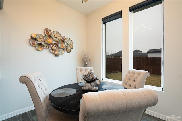 dining area with dark hardwood / wood-style floors