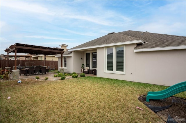 rear view of house with a lawn, a pergola, a patio, and a playground