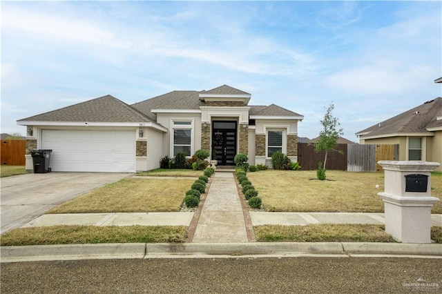 prairie-style house with a garage and a front yard