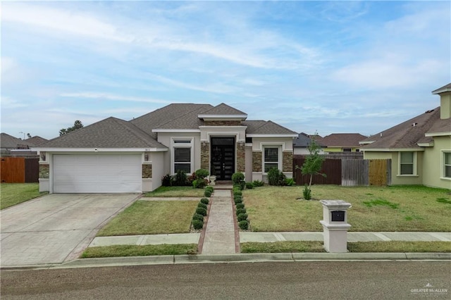 view of front of house featuring a garage and a front yard