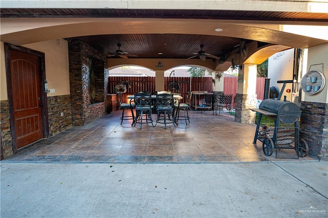 view of patio featuring ceiling fan and area for grilling