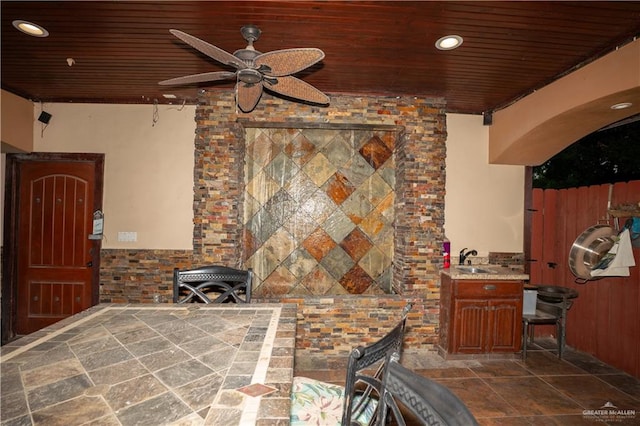 view of patio / terrace with ceiling fan and sink