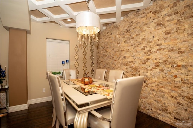 dining area featuring an inviting chandelier, beam ceiling, dark hardwood / wood-style flooring, and coffered ceiling