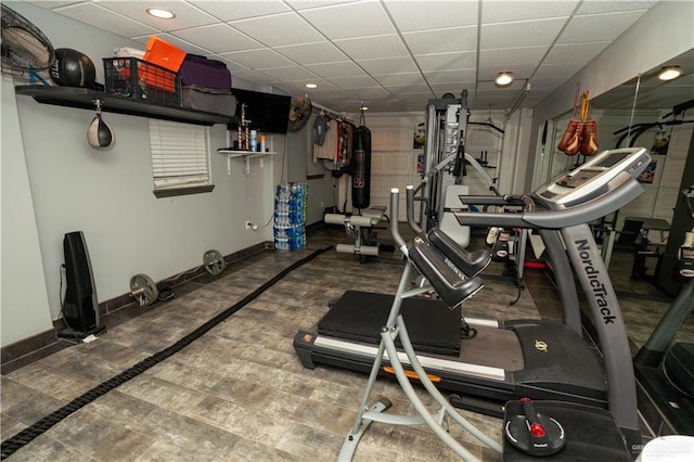 workout room with a drop ceiling