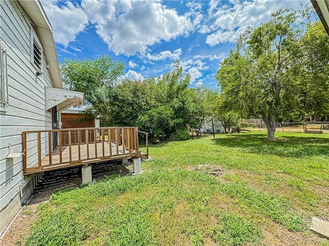 view of yard with a wooden deck