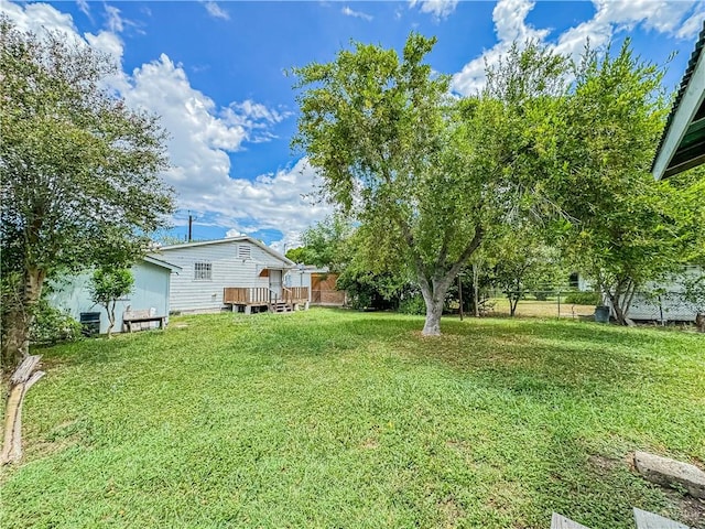 view of yard with a deck