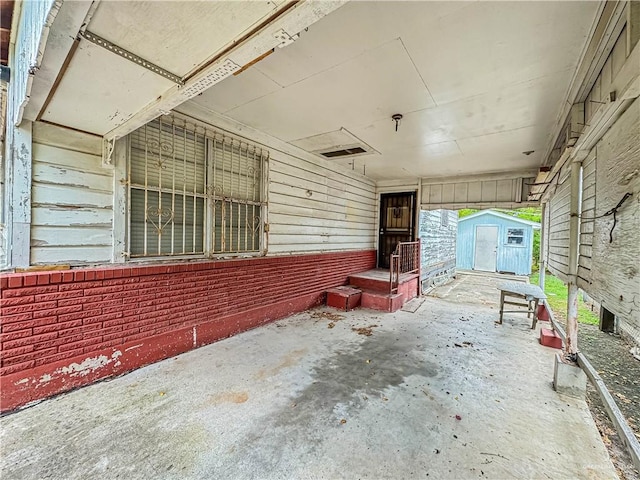 view of patio with a storage shed