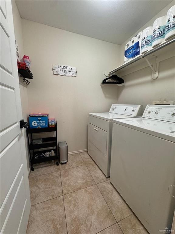 9216 N 31st St, Mcallen, TX 78504 - washroom with washer and dryer and light tile patterned floors
