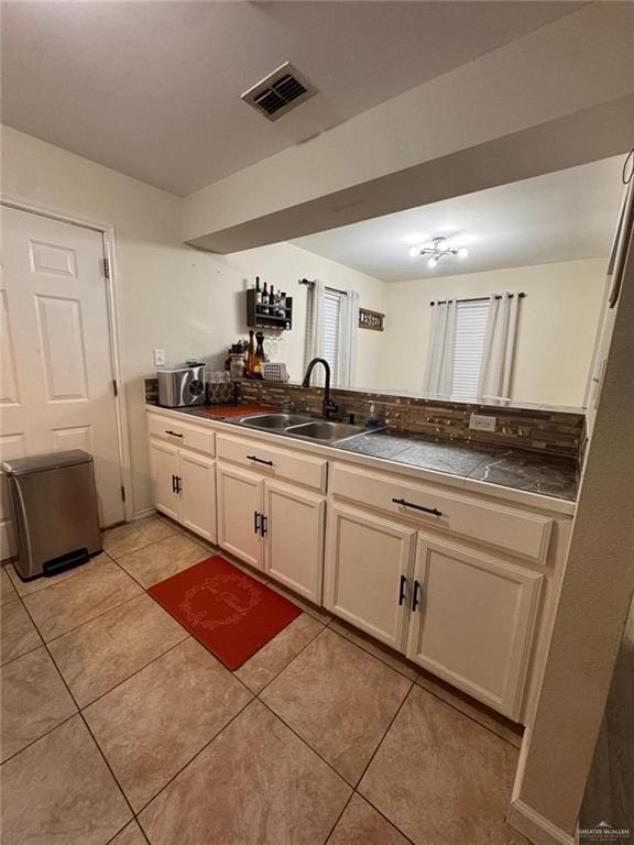 9216 N 31st St, Mcallen, TX 78504 - kitchen featuring light tile patterned floors and dark countertops